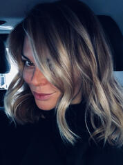 Lisa Marie Bourke in a car with curled hair